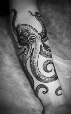 an octopus tattoo on the arm