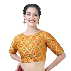 "Beautiful Silk Bandhani Brocade Saree Blouse With Weaving Pattern. Care Instructions: Hand wash seperately Fit Type: Regular This blouse is fully stitched and ready to wear available in many sizes and colours The sleeves are 10.5\" long and the blouse is 15\" in length The fabric used is a very soft bandhni brocade from Benaras This blouse opens from the back with hook and eye and is lined with pure cotton It has a boat neck and ample of margins are provided inside. PRODUCT DETAILS Auction For: