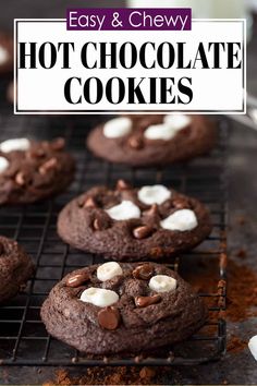 chocolate cookies with marshmallows are cooling on a wire rack in front of the words easy and chewy hot chocolate cookies