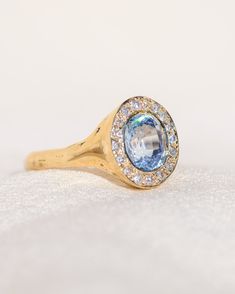 *One of a Kind* hand-carved 14k Yellow Gold ring, set with a stunning oval Sri Lankan Lavender Sapphire, surrounded by a halo of White Diamonds. Center Sapphire is approx. 7 x 6mm and 1.65 ct. 💌 Please write desired size (between 4-8) in *Notes* section at checkout. * Lavender Sapphire from Sri Lanka, is a stone of deep awakening, stimulating the rise of the kundalini transformation energy, while opening your connection with your spirituality. Opening the third eye and crown chakras, it imparts Luxury Lab-created Sapphire Halo Ring, Luxury Lab-created Sapphire Halo Jewelry, Oval Cluster Ring With Halo For Anniversary, Heirloom Sapphire Halo Ring With Halo Setting, Oval Halo Ring For Anniversary With Halo Design, Luxury Oval Cluster Ring With Halo Setting, Luxury Oval Halo Ring As Gift, Luxury Oval Halo Ring For Gift, Formal Oval Topaz Ring With Halo Setting