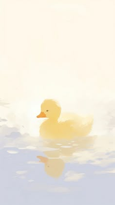 a yellow duck floating on top of water