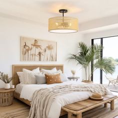 a bedroom with white walls and wooden furniture