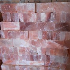 a pile of pink marble blocks stacked on top of each other