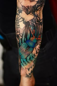 a person with a colorful tattoo on their arm