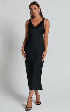 Turn heads and make a statement in our Agnia Midi Dress. This stunning black satin slip dress is the perfect choice for your next cocktail event or special occasion. The plunging neckline adds a touch of allure, while the elasticated back strap detail ensures a comfortable and secure fit all night long. Made from high-quality polyester, this sleeveless dress combines style with comfort, making it an essential addition to your wardrobe. Whether you're hitting the dance floor or sipping cocktails Black Midi Satin Dress, Sleek Midi Slip Dress For Party, Sleek Midi-length Party Slip Dress, Sleek Midi-length Slip Dress For Party, Elegant Black Modal Satin Slip Dress, V-neck Modal Satin Dress For Date Night, Elegant Satin V-neck Dress For Night, Elegant V-neck Satin Night Dress, Modal Satin Spaghetti Strap Midi Evening Dress