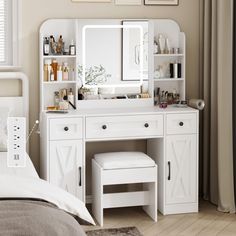 a bedroom with a white vanity, mirror and stools in front of it on the floor