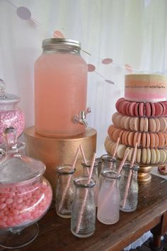 a table topped with lots of different types of candies and candy bar items on top of each other