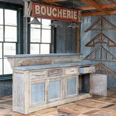 an old fashioned kitchen with wooden floors and walls