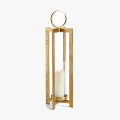 a candle holder with a glass in the middle and a gold frame around it on a white background