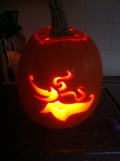 a carved pumpkin sitting on top of a counter