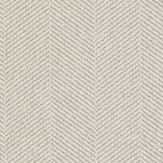 an upholstered white and beige herringle fabric background with small, wavy lines