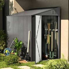 an outdoor storage shed with gardening tools in it