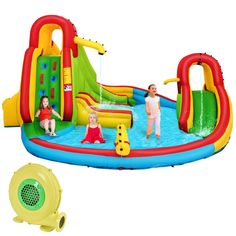 children playing in an inflatable pool with slides and water toys on the ground