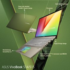 an open laptop computer sitting on top of a green surface with information about the components