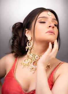 "Shiddat Meenakari Set - Pink Peach Meenakari Necklace Set with Earrings & Tikka. The shell pearls & motifs lend a beautiful chirpy look to Shiddat. Elevate the look of your fancy hair do with the stunning tikka. The set includes a pair of matching earrings. Approximate earrings length is 2.75\". SET INCLUDES : Necklace & Earrings * Tikka can be added Details: Handcrafted Metal: Gold Plated, Metal Alloy Stone: Meenakari Work & Pearls Closure: Post for Pierced Ears DELIVERY: * Rea Pink Meenakari Sets For Reception, Pink Pearl Drop Jewelry For Festivals, Bridal Chandbali Necklace With Mirror Work, Pink Pearl Drop Chandbali Earrings, Pink Pearl Drop Chandbali Jewelry, Pink Tilla Jewelry Sets For Wedding, Bollywood Style Bridal Sets With Meenakari, Pink Hand Set Bridal Earrings For Wedding, Pink Bridal Necklace For Wedding On Diwali