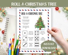 a roll - a - christmas tree game is shown with colored pencils