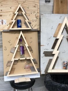 two pieces of wood are stacked on top of each other in the shape of christmas trees