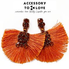 The beauty and diversity of life found in coral reefs reminds us of the beauty and diversity among women. Let's strive to embrace the beauty we find in our diverse backgrounds. The Coral Reef Lobe Love Statement Earrings remind us that together life is discovered. This orange statement earring is sure to make your spring & summer bright. Length: 2.75" Width: 2.5" Gold Hardware Stud Back Closure Fringe and Gemstones Purple is pre-order Orange Earrings For Beach With Pierced Ears, Orange Earrings For Beach, Trendy Orange Drop Earrings, Orange Drop Earrings For Beach, Orange Drop Earrings For The Beach, Orange Dangle Earrings For Beach, Orange Dangle Earrings For The Beach, Orange Tassel Drop Earrings, Orange Beaded Earrings For Summer