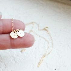 "Tiny Gold Initial Necklace This delicate little initial is hand stamped on a tiny gold filled charm {8mm}. It is customized for you with an initial of your choice. It adorns a 14kt gold filled shimmering link chain. Select up to 4 charms for your necklace! D E T A I L S -Choose from 1-4 tiny discs -Disc measures 8mm - 14kt Gold-Filled discs and necklace -A high quality delicate link chain with a spring clasp. -Polished to a light satin finish. CUSTOM HAND STAMPING -Hand stamped with an initial. Dainty Initial Necklace With Charms For Personalized Gift, Dainty Hand Stamped Charm Necklaces For Everyday, Dainty Hand Stamped Charm Necklace For Everyday, Dainty Charm Necklaces For Personalized Gifts, Dainty Hand Stamped 14k Gold Charm Necklaces, Personalized Gold Charm Necklaces For Best Friend Gift, Dainty Hand Stamped Charm Necklace For Anniversary, Dainty Hand Stamped Round Charm Necklace, Dainty Round Hand-stamped Charm Necklace