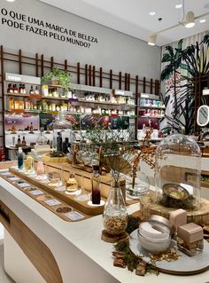 a store with many items on display in front of the counter and shelves full of bottles