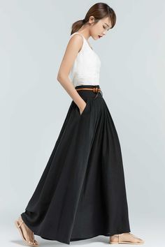 "This Black maxi skirt is the perfect piece for your wardrobe. The Linen skirts is perfect for an afternoon in the city or a walk in the country, the vintage skirt in a wonderful staple, this long skirt will match a variety of ensembles and makes this a must-have. For a twirl-worthy look, pair it with a white blouse or chunky knit sweater and you'll look stylish wherever you're going. Numerous pleats make this a roomy and comfortable skirt. DETAIL * 50% linen ,50% cotton * No Lining * Pleated wa Casual Voluminous Maxi Skirt With Pleated Waist, Summer Flared Maxi Skirt With Lined Detail, Summer Flared Maxi Skirt With Lined Skirt, Summer Flared Maxi Skirt With Lining, Summer Pleated Waist Maxi Skirt, Summer Maxi Skirt With Pleated Waist, Voluminous Pleated Long Skirt, Summer Long Maxi Skirt With Pleated Waist, Black Long Skirt With Side Pockets