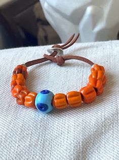 Handmade orange round glass beads on a cognac suede bracelet, adjustable, Unisex Boho Leather Bracelet, Surf Bracelet, Suede Bracelet, Beach Bracelet, Orange Bracelet, Leather Tie, Beach Bracelets, Handmade Glass Beads, Boho Leather