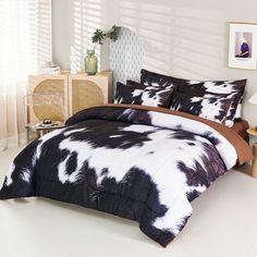 a black and white comforter with brown accents