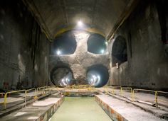 the inside of a tunnel with some lights on