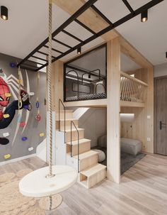 this is a loft bed with stairs and climbing equipment on the wall next to it