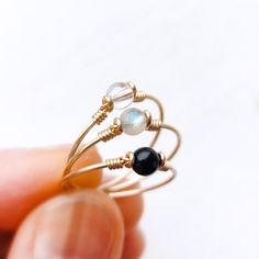 Dainty Adjustable Birthstone Ring With Round Stone, Adjustable Crystal Ring For May Birthstone, Adjustable Round Emerald Crystal Ring, Adjustable Emerald Crystal Ring, Dainty Adjustable Moonstone Ring Gift, Dainty Adjustable Birthstone Ring, Adjustable May Birthstone Ring, Moonstone Birthstone Ring Gift With Round Band, Dainty Adjustable Stackable Rings With Round Stones