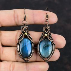 Note : Due to the natural formation of this gemstone. Slight variation in design and color are to be expected.  Labradorite Copper Earring Copper Wire Wrapped Earring Gemstone Jewelry Handmade Earrings Copper Wire Jewelry Gifts For Her Amazing Earrings Handmade Copper Earrings SKU : VFWE-234 Gemstone : Labradorite  Stone Shape : Oval    Metal Purity : Copper Earrings Length : 73 MM   Earrings Width : 23 MM Labradorite has many physical benefits - grab this crystal to relieve arthritis, boost your metabolism and immune system, ease chest infections and cold/flu symptoms. This crystal is also said to regulate hormones, reduce PMS, ease gout and lower blood pressure. Labradorite Drop Earrings With Natural Stones, Wire Wrapped Labradorite Drop Earrings, Labradorite Earrings For Pierced Ears As Gift, Labradorite Earrings As A Gift, Labradorite Earrings Gift, Unique Labradorite Drop Earrings, Labradorite Gemstone Earrings, Gemstone Labradorite Earrings, Wire Wrapped Labradorite Earrings For Jewelry Making