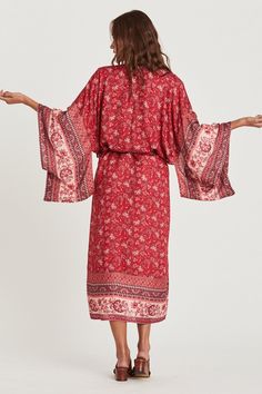 Behold a windswept bohemian beauty in Coa Kimono! Vibrant and floral sheer fabric flows to the beat of an artsy vibe. Thanks to its wing-like long sleeves and midi length, this kimono robe ensures full coverage for swim suit babes. Gracefully show your appreciation with Coa Kimonos as special bridal party gifts. Infuse down time with flower power. Details: bohemian style Coa Kimono long sleeves midi length matching waist sash colorful floral print fabric is sheer Fabric + Care: Rayon, Cotton blend. Machine wash with mild detergent. Tumble dry normal or line dry for best shape. Steam or iron to your liking. Coa Kimono, bohemian style fall outfit, cute fall outfit ideas, floral kimonos, pretty kimono robe, bridal party gifts, ShoptheKei.com Bohemian Floral Print Wrap Maxi Dress, Bohemian Printed Kimono For Brunch, Spring Hippie Wrap Kaftan, Bohemian Long Kimono For Brunch, Hippie Wrap Kaftan For Spring, Spring Hippie Flowy Kaftan, Flowy Bohemian Kimono For Brunch, Long Sleeve Boho Dress As Beach Cover-up For Spring, Bohemian Rayon Kaftan For Spring