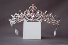 A small pink crown. The crown is perfect for both children and adults due to its small size and weight. Beautiful sparkling tiara with pink crystals in gold or silver plated. Incredible tiara that will look great on the bride. I'm sure you will get a lot of compliments. Height of the tiara - 2"( 5 см) Features: Tiara made with pink crystals and rhinestones Sturdy metal frame Delicate crystal pattern Care instructions: Avoid contact with water Clean with a soft cloth Store in a cool, dry place Pa Pink Crowns, Pink Princess Crown, Mini Tiara, Crystal Wedding Crown, Pink Tiara, Tiara Silver, Crystal Crown Wedding, Headband Crystal, Crown Pink