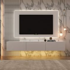 a large television mounted to the side of a wall in a room with marble walls