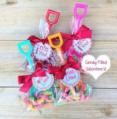 candy filled valentine's lollipops in cello bags with i do tags