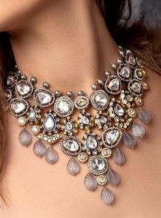 Polki & Carved Stone Bridal Necklace Set - Joules By Radhika Embrace the allure of grace with our 22Kt Gold Plated necklace set. The enchanting Hydro Polkis and elegant grey carved Agates create a mesmerizing symphony of beauty. Perfect for brides seeking sophistication on their wedding day. Shine bright, creating cherished memories as you celebrate your love story with this exquisite set! SET INCLUDES: Necklace and Earrings Details: Handcrafted with ❤️ Metal: Brass Product Type: Necklace Stone: Luxury Traditional Bridal Necklace With Mirror Work, Luxury Multicolor Stone Work Bridal Necklace, Luxury Bridal Necklace For Puja With Intricate Design, Luxury Temple Jewelry Bridal Necklace With Mirror Work, Luxury Silver Kundan Necklace With Peacock Design, Luxury Kundan Necklace With Intricate Design, Luxury Silver Kundan Tikka, Polki Bridal Set, White Indian Jewelry