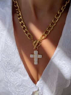 A handmade gold necklace with a unique Cross charm at the center that has a white type of stones on it that are made from enamel. The connection is at the front side with a circle part so it can not be adjusted. In Christina Christi Jewels store you can see more than 50 designs in Women's Necklaces. You can have them in 2-4 Days with DHL EXPRESS SHIPPING MATERIALS - Gold filled Chains are made from Aluminium. - White Cross charm made from brass with White type of stones on it (enamel). DIMENSION White Metal Clavicle Chain Jewelry, Enamel Chain Jewelry As A Gift, Enamel Chain Jewelry As Gift, Enamel Chain Jewelry For Gifts, Enamel Pendant With Adjustable Chain, Gold Chain Cross Necklace For Gift, Handmade Gold Enamel Necklaces, Gold Enamel Pendant Necklace, White Cross Chain Jewelry