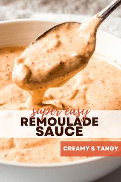 a spoon full of creamy and tangy homemade remoulade sauce in a white bowl