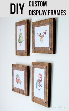 three wooden frames with christmas pictures hanging on the wall and text overlay that says diy custom display frames