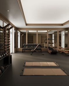 an empty gym with exercise mats on the floor