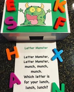 a box with magnets on top of it that says letter monster and has letters attached to the front