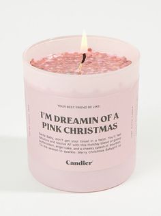 a pink candle with the words i'm dreaming of a pink christmas written on it