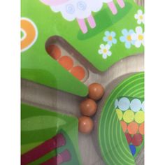 a close up view of some candy on a plate with animals and flowers in the background