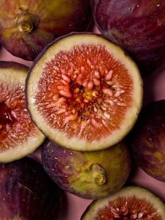 the figs are cut in half and ready to be picked from the bushel