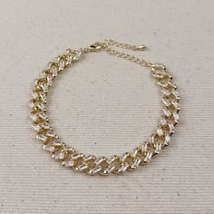 Indulge in luxury with our 18k Gold Filled Iced Chunky Cuban Bracelet. The sparkly, glamorous design will elevate any outfit, making you feel like a true fashion icon. Treat yourself or a loved one to the ultimate statement piece. Metal: 18k Gold Filled AAAAA Cubic Zirconia Stones Sizes : 7.25 inches +2 inches extender Hypoallergenic Water-resistant Handcrafted in Brazil Gold Plated Bracelets For Party, Gold Plated Bangle Chain Bracelet For Parties, Party Crystal Chain Bracelets, Crystal Chain Bracelet For Party, Elegant Bling Chain Bracelet For Parties, Gold Plated Chain Bracelet For Party, Party Diamond Bracelet With Adjustable Chain, Party Bracelets With Adjustable Chain And Crystal, Cubic Zirconia Gold Bangle Bracelet For Party