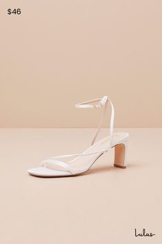 Keep things chic and simple by adding the Lulus Kierha White Satin Strappy Low Heel Sandals to any of your effortlessly elegant 'fits! Sleek woven satin shapes these darling heels that feature a square footbed and a trio of slender straps that cross the vamp. A matching strap wraps the front of the ankle and secures with a gold buckle, all atop a trendy blade heel. 2. 75" wrapped blade heel. Cushioned insole. Felted rubber sole has nonskid markings. Man made materials. Imported. Lulus | Kierha W White Low Heeled Sandals, Chic Open Toe Wedding Shoes With Wrapped Heel, White Low Heel Lulus, Chic Fitted Ankle Strap Wedding Shoes, Summer Wedding Shoes With Wrapped Heel, Chic Fitted Wedding Shoes With Ankle Strap, Summer Wedding Shoes With Ankle Strap And Padded Heel, Summer Wedding Shoes With Padded Heel And Ankle Strap, Chic Fitted Sandals For Wedding