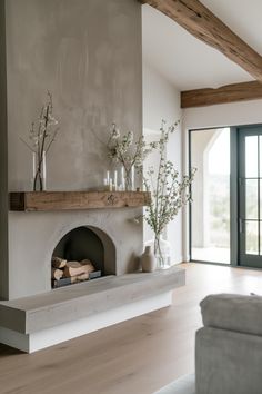 a living room filled with furniture and a fire place