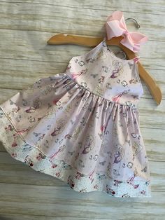 ★*.*'.*★Princess & Friends Toddler Dress★*.*'.*★ The dress is a sundress style, with extra long straps to make a fancy bow at the back.  The back has elastic for a snug fit. The bottom is trimmed with a Coordinating fabric  for an extra fancy style. Beautiful soft shade of pink. Ready to ship Available in sizes 2T & 3T Care Instructions: Dresses are made from 100% Cotton and wash best on cold / hang to dry to prevent shrinking* Fitted Whimsical Twirl Dress For Summer, Whimsical Fitted Twirl Dress For Summer, Cute Dresses With Spaghetti Tie Straps, Spring Playtime Dress With Bow, Summer Princess Playtime Dress, Playful Sleeveless Dress With Tie Straps, Whimsical Summer Playtime Dress, Cute Cotton Dresses With Tie Straps, Spring Dress With Bow Straps For Dress-up Occasions