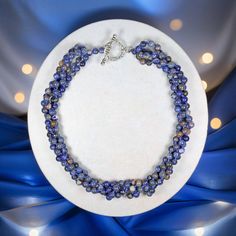 "Four Strands of hand-beaded and knotted genuine Sodalite round beads make this beautiful statement necklace. Necklace Length: 19\" L. Major Beads/material: 7mm round-shaped Sodalite and blue thread. Color: Blue Findings: silver-tone toggle clasp. Workmanship: each bead is hand-beaded and knotted  https://www.etsy.com/shop/MYGEMSROCK" Lapis Lazuli Gemstone Beads Crystal Necklace, Lapis Lazuli Crystal Necklace With Gemstone Beads, Handmade Sodalite Round Bead Necklaces, Sodalite Gemstone Beads Necklaces, Handmade Sodalite Round Beads Necklace, Blue Sodalite Round Beaded Jewelry, Blue Lapis Lazuli Crystal Necklaces With Round Beads, Blue Lapis Lazuli Round Beads Crystal Necklace, Lapis Lazuli Beaded Necklaces For Jewelry Making