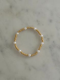 - faux pearls Pearl Beaded Bracelets With Round Beads, Pearl Chain Beaded Bracelets, Pearl Stretch Bracelet With Gold Beads, Dainty Beaded Pearl Bracelet, Pearl Bracelets With Gold Round Beads, Yellow Gold Beaded Bracelets With Pearl Charm, Gold Beads Pearl Bracelets, Dainty Gold Bracelets With Pearl Chain, Dainty Gold Pearl Bracelet With Pearl Charm